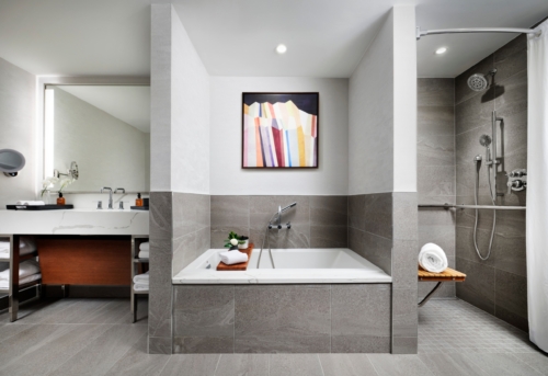 ADA-accessible bathroom with soaking tub and roll-in shower at Hotel Alpenrock.